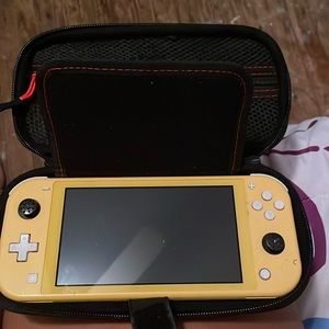 Nintendo switch light yellow in good condition with animal crossing & case